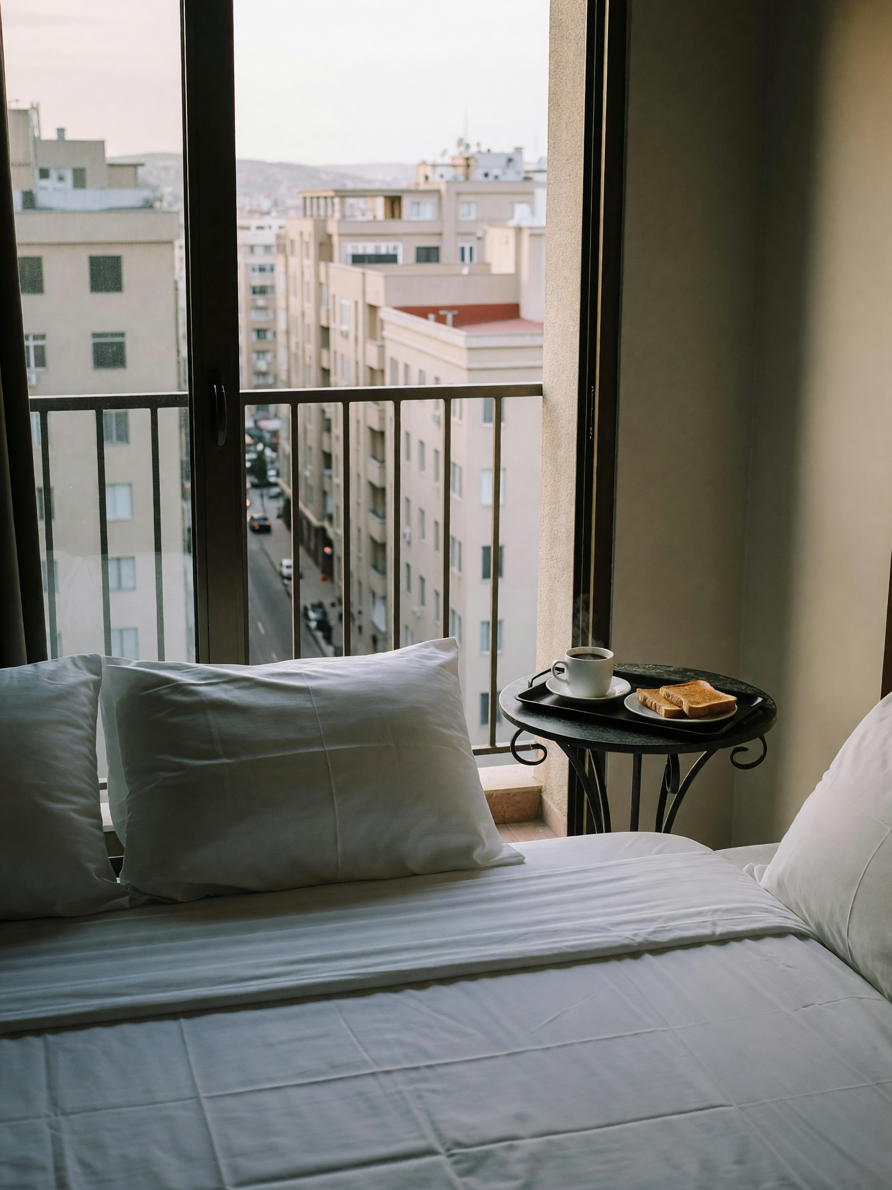 room service breakfast hit different after that flight. bed's huge, view's decen
