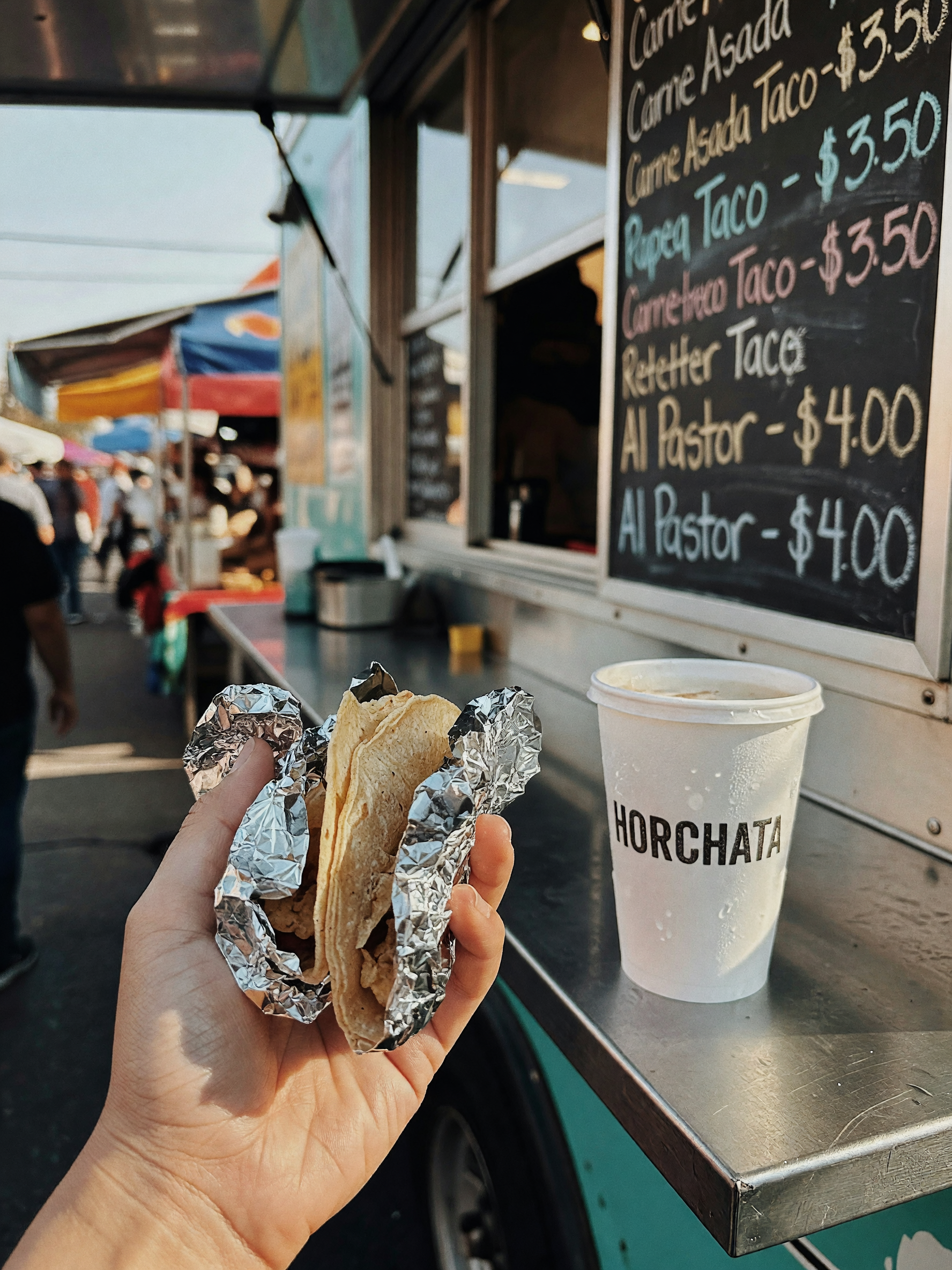 grabbed two al pastor tacos and a horchata from the truck before heading back, a