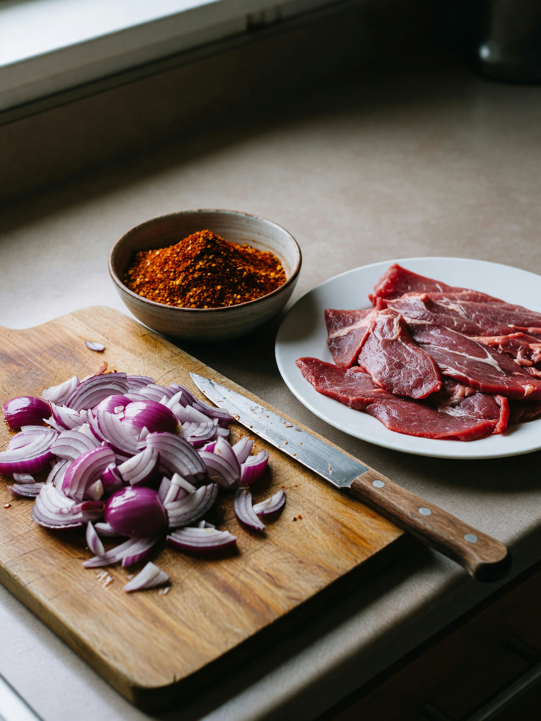 trying to recreate my aunt's tibs recipe and my cutting board is already a battl