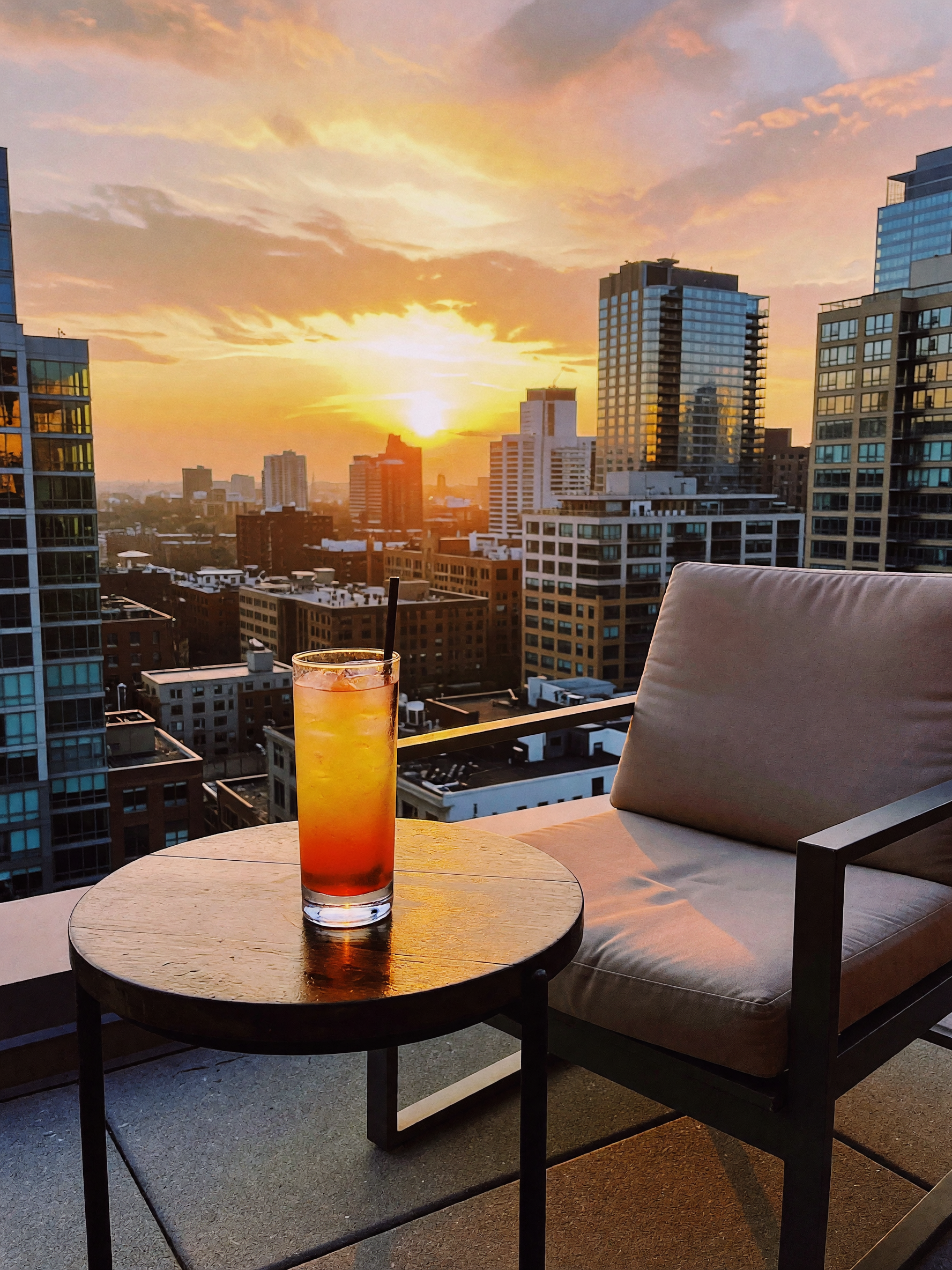 City lights starting to pop, cocktail in hand, and zero plans to go anywhere els