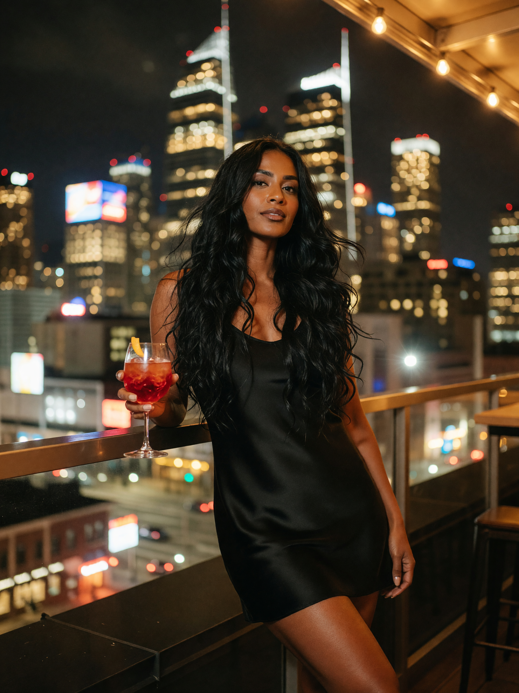 silk slip, city lights, and a manhattan that's almost as smooth as this skyline.