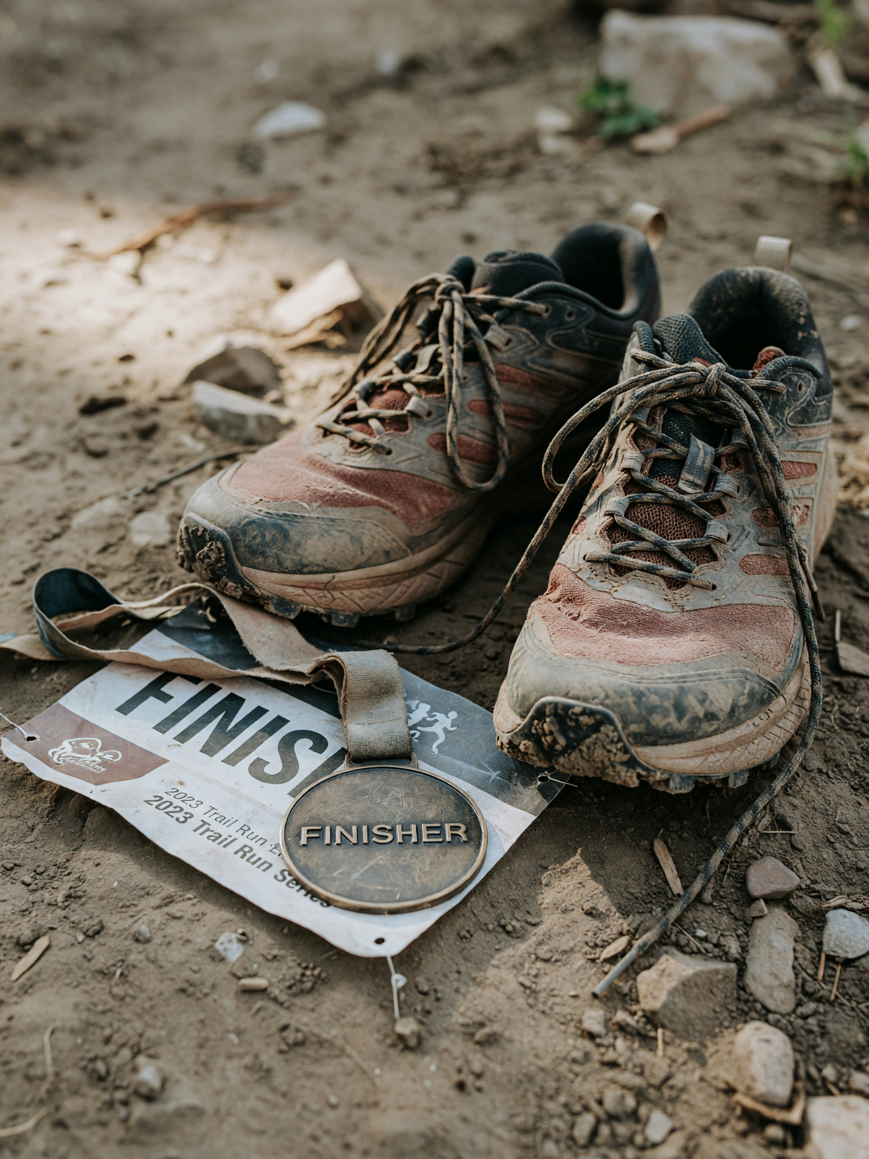 medal secured, shoes covered in dirt, race bib still pinned on. weekend 10k done
