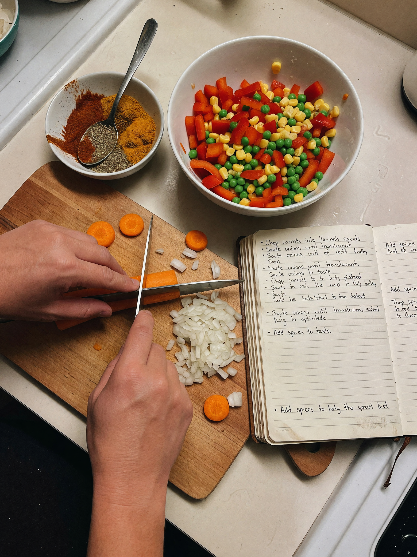 trying out this new stew recipe, chopping carrots and onions while the rice simm