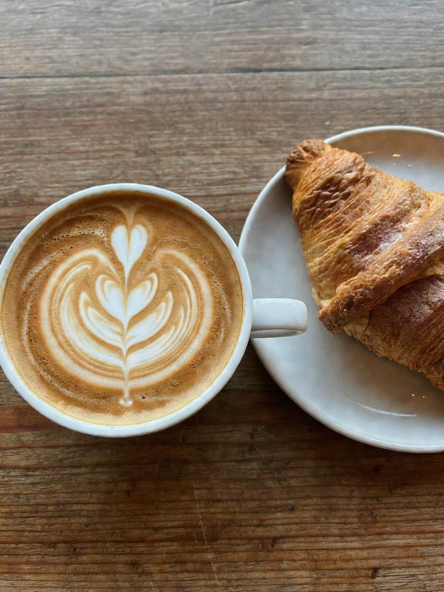 Slow morning at my favorite window seat with a perfect flat white and almond cro