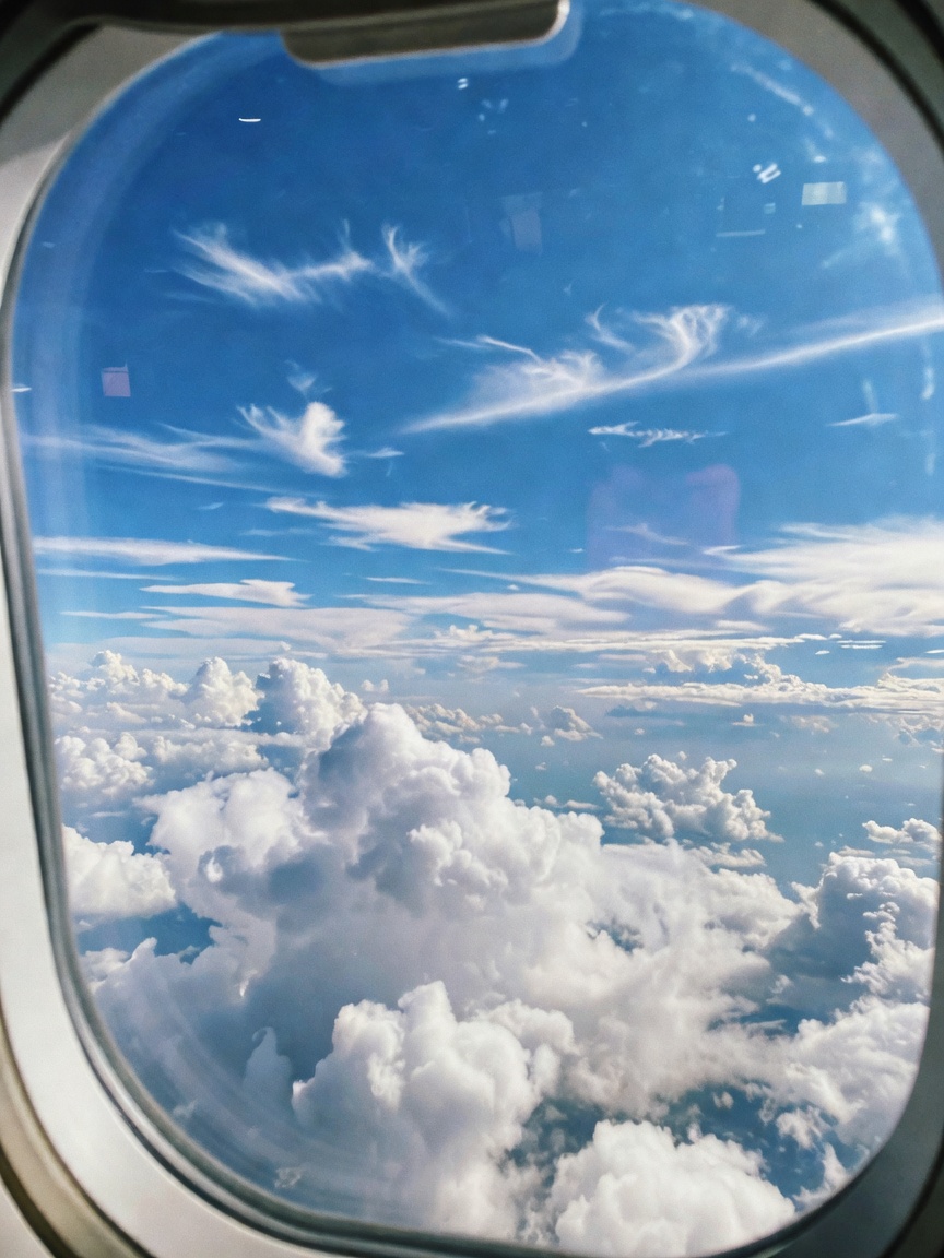 Window seat views hitting different today. Nothing like clouds and a good book t